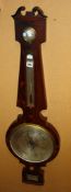 A Victorian mahogany mercury wheel barometer, the 10 inch circular silvered scale engraved with