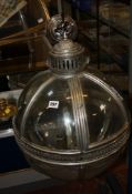 A silver metal spherical lantern. There is no condition report available for this lot.