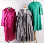 A collection of vintage clothing, comprising: a 1950s vibrant green duster coat; a silver grey