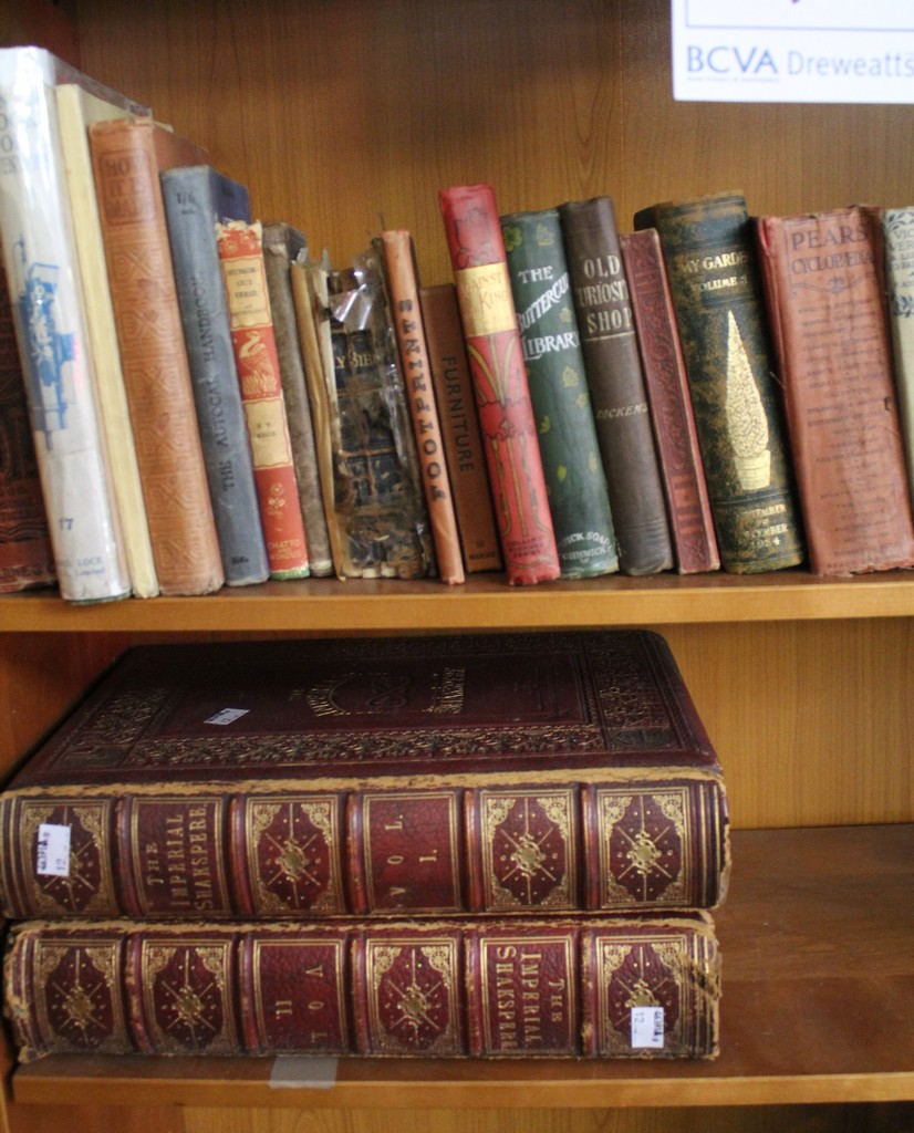 Two large leather bound Shakespeare books and others. There is no condition report available for