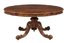 A Victorian burr walnut and walnut centre table circa 1870 the oval top with shaped edge and frieze
