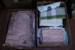 A quantity of household linens, comprising: sheets, table cloths and other smaller items.