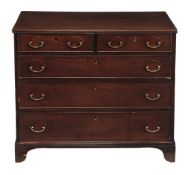 A George III mahogany chest of drawers, circa 1800, the rectangular top with reeded edge above two