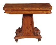 A George IV burr yew wood card table, circa 1825, the hinged rectangular top opening to a circular