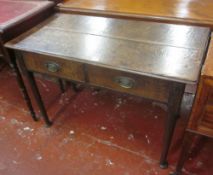 A George III oak side table, circa 1780, rectangular top, two frieze drawers, turned tapered legs
