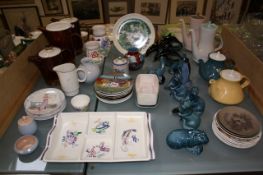 A collection of Poole pottery, including: blue otters, dolphins, sea lions, coffee pots, vases etc.