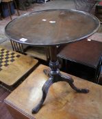 A George III style mahogany tripod table 63cm high, 56cm diameter There is no condition report