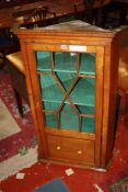 A fruitwood corner cupboard with astragal glazed door 115cm high, 71cm wide There is no condition
