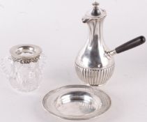 A silver coloured plate by Birks, with a pierced band, 15cm diameter; a cut glass baluster three