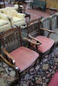 A pair of Victorian spindle back armchairs with upholstered seats