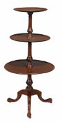 A 19th century mahogany three tier dumb waiter, with moulded dish edge to tiers, on spiral reeded