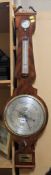 A Victorian mahogany mercury wheel barometer, the 10 inch circular silvered register engraved with