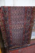 A Caucasian rug, 250cm x 98cm approx.
