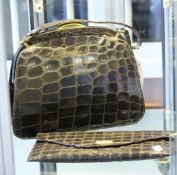 A 1950s Geoffrey Richard alligator skin handbag; together with a clutch bag made in Spain by J