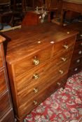 A George III mahogany chest with two short and three long drawers on splayed feet 99cm wide