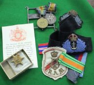 Three World War II medals; together with two World War I medals; a silver easel support, cloth
