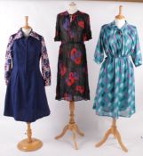 A collection of vintage clothing, comprising: a 1950s blue lace dress; a floral Chelsea Girl