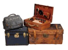 A collection of vintage luggage, Edwardian and later, comprising a leather vanity case and linen