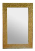 A pair of embossed brass wall mirrors, late 20th century, each with large mirrored plates and wide b