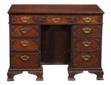 A George III mahogany kneehole desk, circa 1780 and later, with single frieze drawer above single