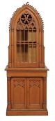 A Victorian pine Gothic Revival cabinet on cupboard, circa 1870, the domed cabinet with crenelated d