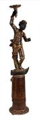 An Italian carved, polychrome painted and parcel gilt wood blackamoor stand, second half 19th