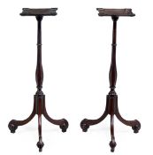 A pair of mahogany torchere stands in George III style, late 19th/ 20th century, each square top