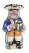 A Yorkshire pearlware `Ruddy-Faced` Toby jug of Pratt-type, early 19th century A Yorkshire pearlware