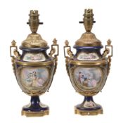 A pair of Sevres-style gilt-metal mounted urns, late 19th century A pair of Sevres-style gilt-