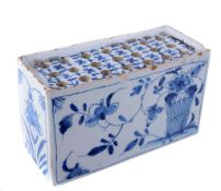 An English delft blue and white flower-brick An English delft blue and white flower-brick, circa