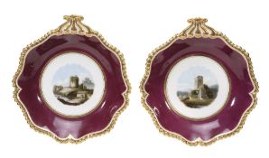 A pair of Worcester claret-ground and gilt titled landscape shell-shaped... A pair of Worcester (