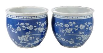 A pair of modern Chinese blue and white jardinieres , decorated with prunus A pair of modern Chinese