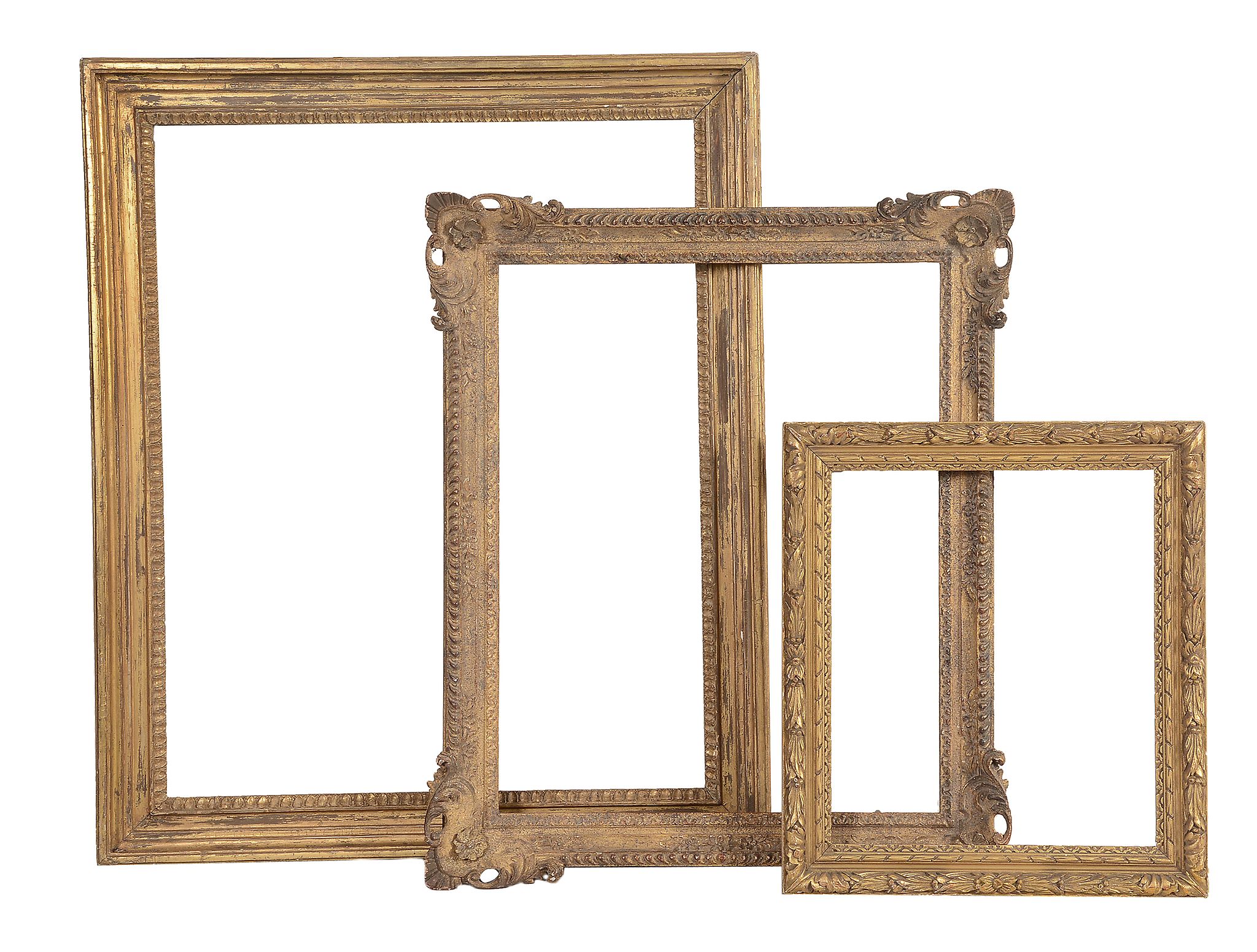 An early 19th Century carved water-gilt frame - together with two carved gilt frames in 18th century