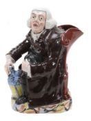 A Staffordshire pearlware `Nightwatchman` Toby jug, circa 1830, of typical form A Staffordshire