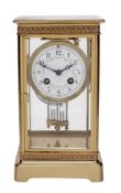 A French lacquered brass four-glass mantel clock, Samuel Marti and Cie, Paris A French lacquered