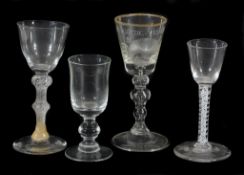 A Dutch engraved baluster `Friendship` wine glass, mid 18th century A Dutch engraved baluster `