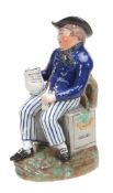 A Staffordshire pearlware `Sailor` Toby jug, first quarter 19th century A Staffordshire pearlware `