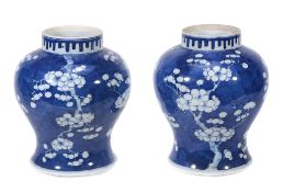 A pair of Chinese blue and white ginger jars of typical form decorated all... A pair of Chinese blue