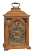 A Continental fruitwood small English style table clock with alarm A Continental fruitwood small