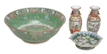 A Chinese famille rose punch bowl decorated with cabbage leaves and... A Chinese famille rose