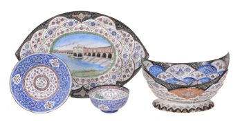 A group of four Indian or Islamic enamel decorated wares including a plate A group of four Indian or