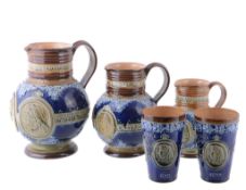 A set of three Doulton Lambeth stoneware graduated commemorative jugs A set of three Doulton Lambeth