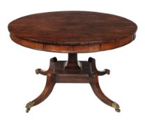 A Regency rosewood drum table circa 1815 with a circular top and four frieze...  A Regency