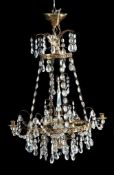 A Continental gilt metal and cut glass hung four light chandelier in Swedish...  A Continental