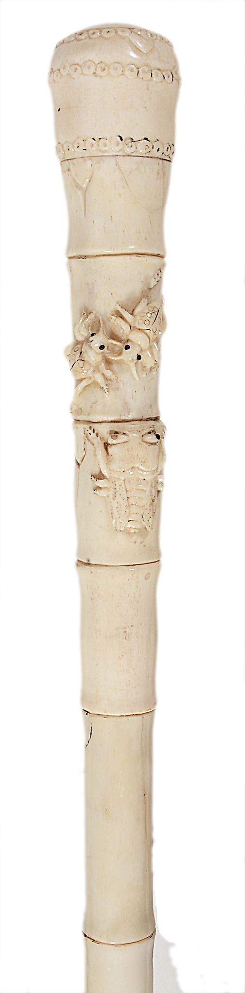 An Oriental carved whalebone walking stick, late 19th century  An Oriental carved whalebone
