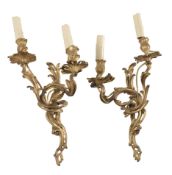 A pair of gilt bronze twin light wall appliques in Rococo style, 19th century  A pair of gilt bronze