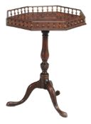 A George III mahogany supper table circa 1770 the hexagonal top with spindle...  A George III