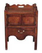 A George III mahogany bedside cupboard, circa 1780  A George III mahogany bedside cupboard,