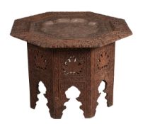 A n Indian carved hardwood and copper inset octagonal table  A n Indian  carved hardwood and