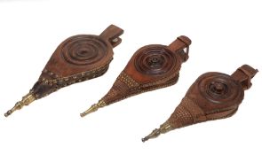 Three pairs of stained wood and leather bellows, second quarter 19th century  Three pairs of stained